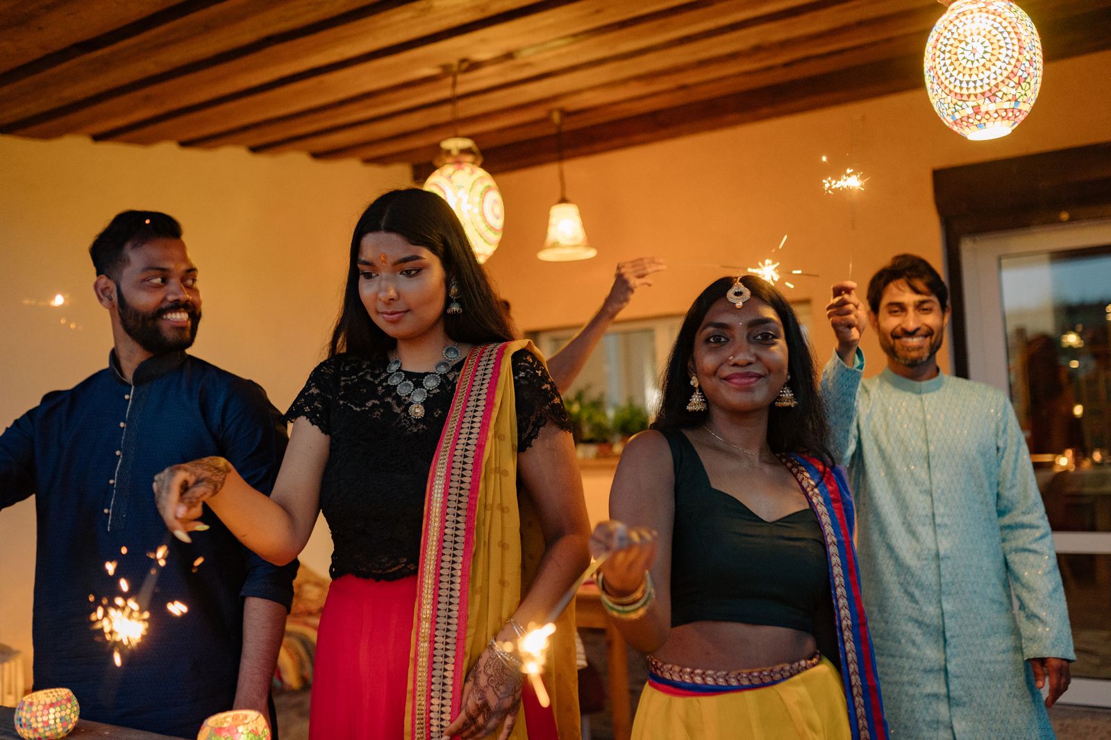 Colleagues in festive wear celebrating Diwali together